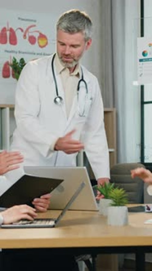 Medical Team Meeting in Office with Diverse Staff