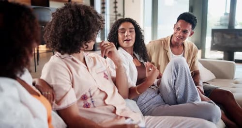Friends Relaxing and Talking on Sofa
