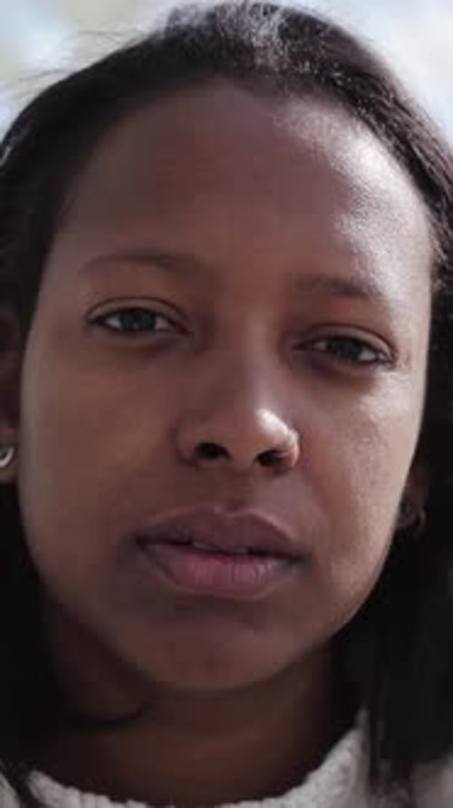 Close Up Face Serious Beautiful Young African American Generation z Woman Posing Worried Indoors