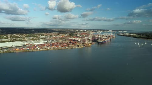 Calm Waters Of Test River With Industrial Port Operating Company In Southampton, United Kingdom. - a