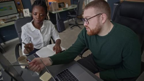 Young Diverse Colleagues Working on Business Project in Office Together