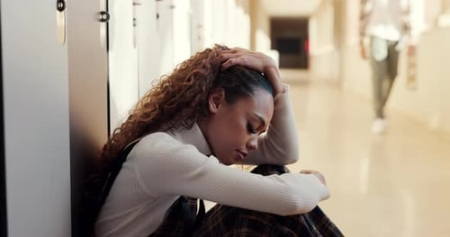 University, girl in hallway with stress and anxiety from school work, student loan debt