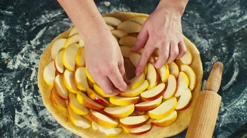 Preparing Delicious Apple Pie with Fresh Fruit Slices