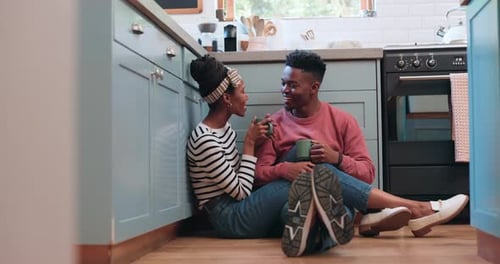 Cheerful Couple Chatting in Kitchen
