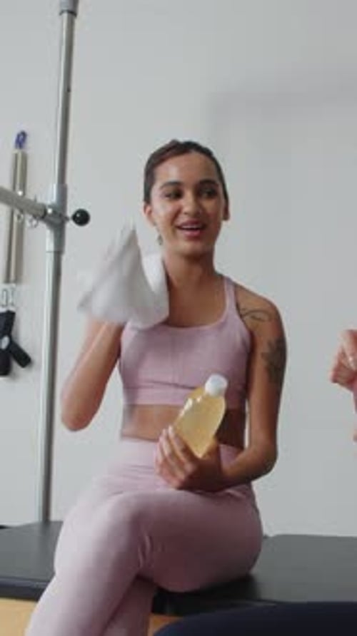 Sportswomen Having Healthy Drinks after Workout