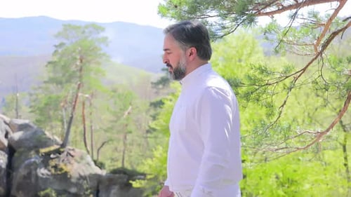 Tourist Holiday Hike to the Top A Man in White Clothes Climbs Up Tourist Walk