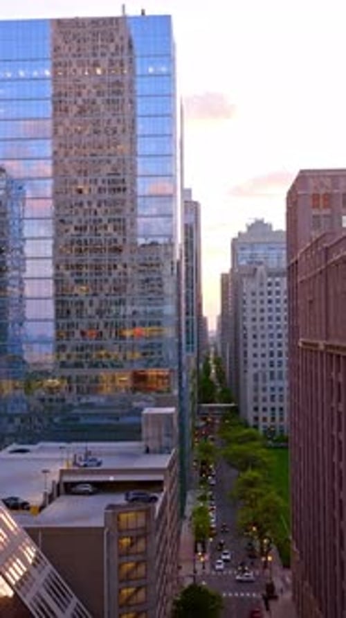Drone raising high above the long street in Chicago.