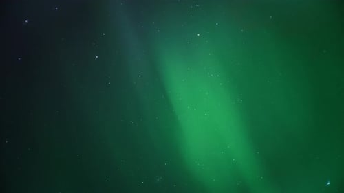 Green Aurora Borealis and Stars at Night