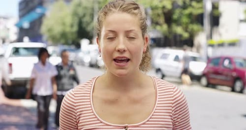4k video footage of a young woman being interviewed about travel destinations on the street