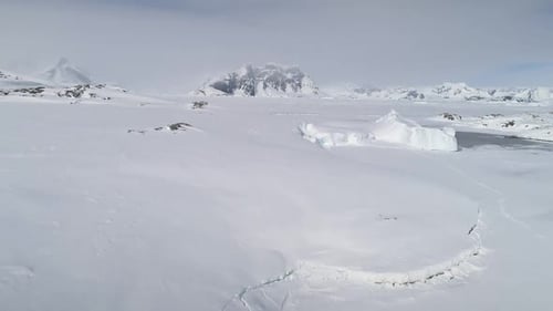 Snow Covered Antarctica Mountain Aerial View