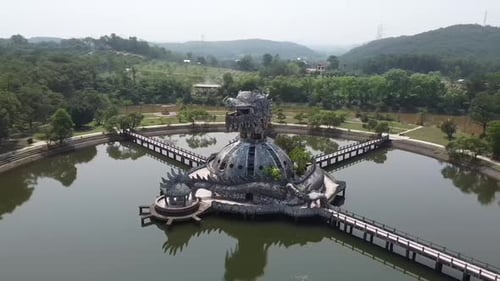 Aerial of Ho Thuy Tien abandoned water park with huge dragon structure