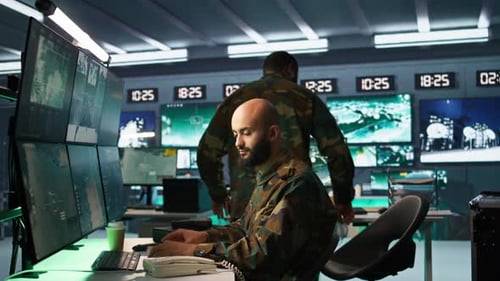 Adults Working in High Tech Control Room