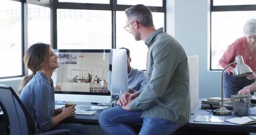 Colleagues, coworking and modern office with computers, training and diversity in workplace
