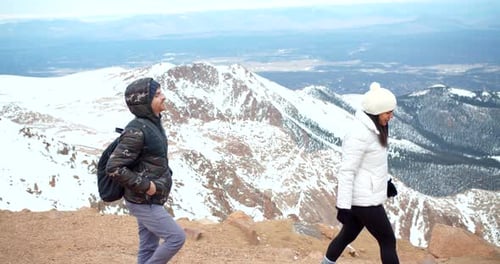 Couple Taking Photos at Top of Snowy Mountains, View From Peak Adventure