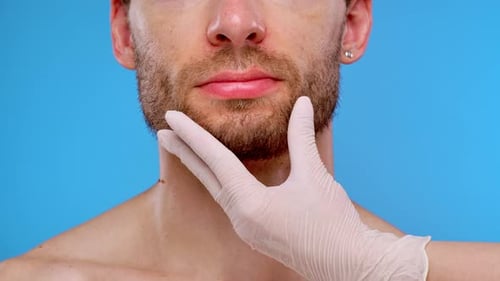 Receiving Cosmetic Lip Fillers Injection Treatment