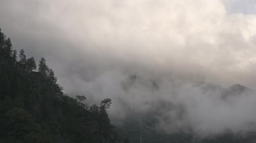 Timelapse of Mountain Peaks and Clouds It is Getting Dark and the Weather in the Mountains