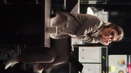 Businesswoman Working on Laptop with Grimace