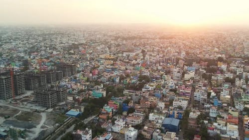 Dramatic Sunrise Shot Of Crowded City Filled With Buildings And Trees