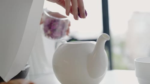 Close Up of Woman Making Tea at Home