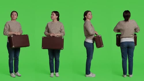 Female Model Holding Suitcase Baggage on Camera