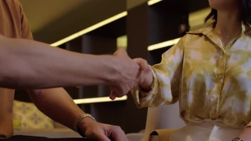 Unrecognizable Business Colleagues Giving Each Other Handshake
