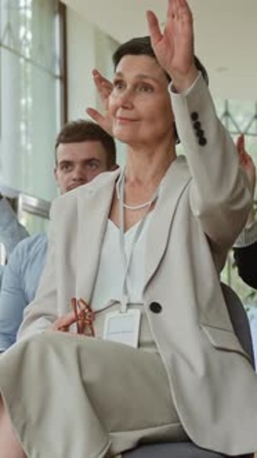 Business Woman Asking Question at Corporate Event