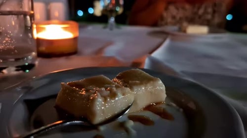 caramel pudding on candlelit table