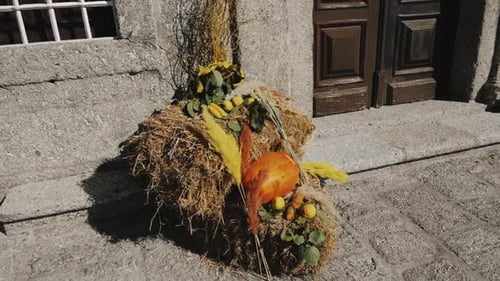 Autumnal Outdoor Display with Hay and Pumpkin