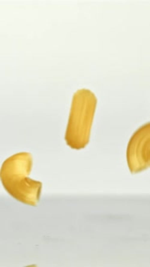 Super Slow Motion Dry Macaroni Pasta Filmed on a Highspeed Camera at 1000 Fps