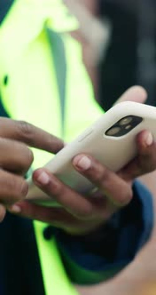 Phone, man and hands on construction site with developer for building, renovation project