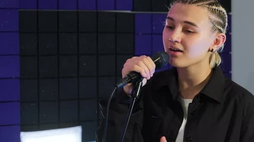 Blond Haired Singer Performing in Recording Studio