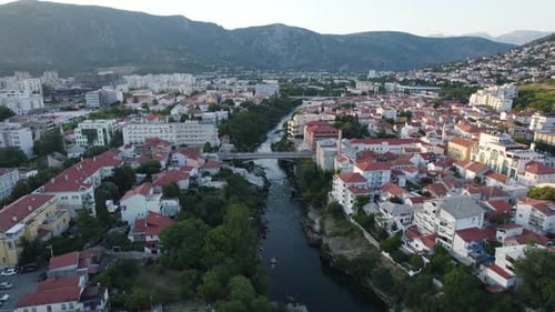 Mostar Evening Glow by Historic Neretva River, Aerial Fly-over