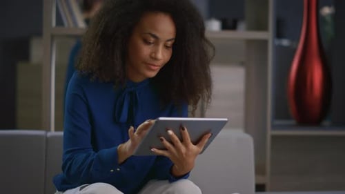 Calm African American Entrepreneur Woman Working Tablet Drinking Coffee in Home Office