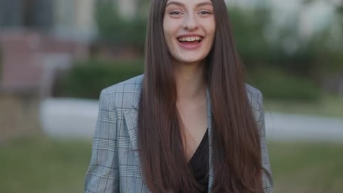 Excited Woman Reacts with Surprise Outdoors