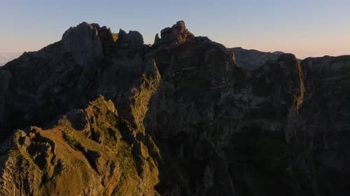 Stunning mountain landscape at sunset showcases dramatic rock formations