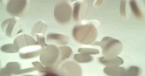 Medication, tablets and healthcare drugs pills falling on a studio background for pain relief