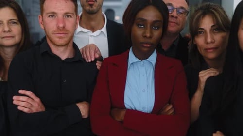 Group of multigenerational business team looking in front of camera during meeting work