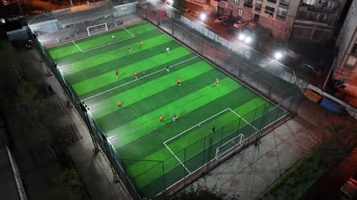 Top View of Soccer Field at Night – Drone Footage