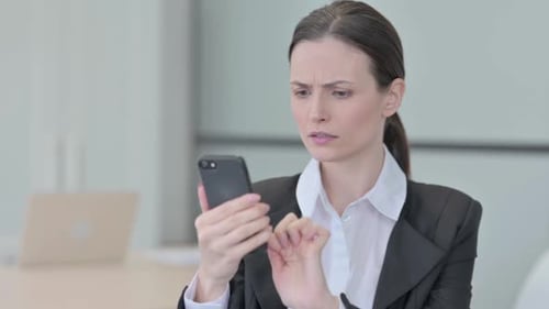 Woman Receives Bad News on Smartphone