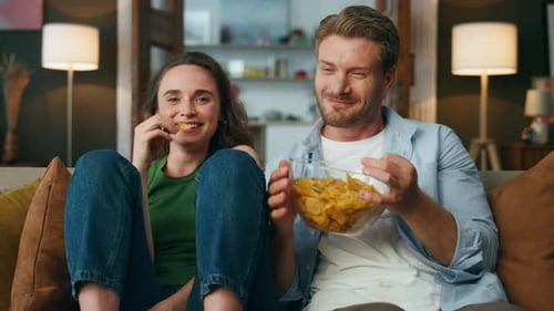 Laughing People Having Fun Indoor Pov Emotional Pair Watching Television Eating