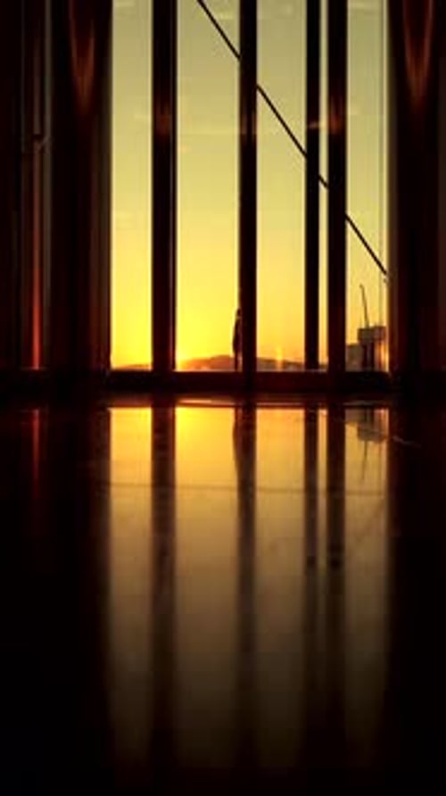 The Beautiful Reflection of the Sunset Can Be Seen Through Stunning Glass Windows