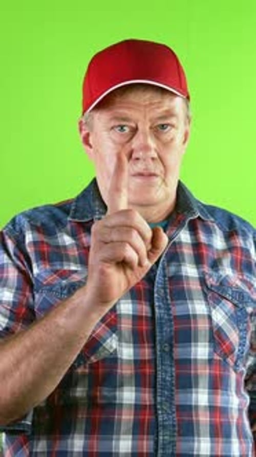 Mature Man Gestures Pointing and Giving Thumbs Up