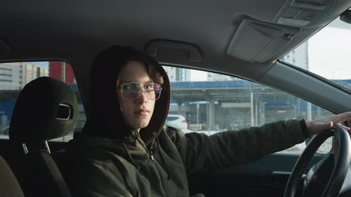 Young Adult Driving in the City