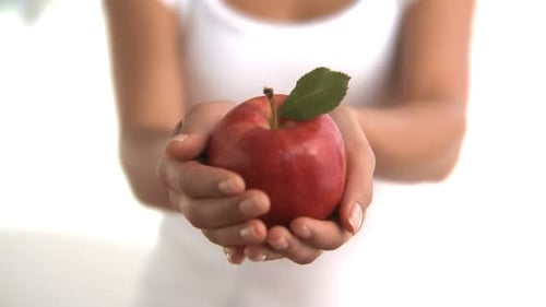 Woman Holding Ripe Red Apple Studio
