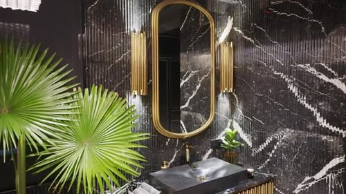 Stylish Bathroom with Black Marble and Gold Accents