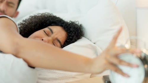 Couple Waking Up and Cuddling in Bed