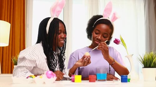 Friends Painting Easter Eggs Together Indoors