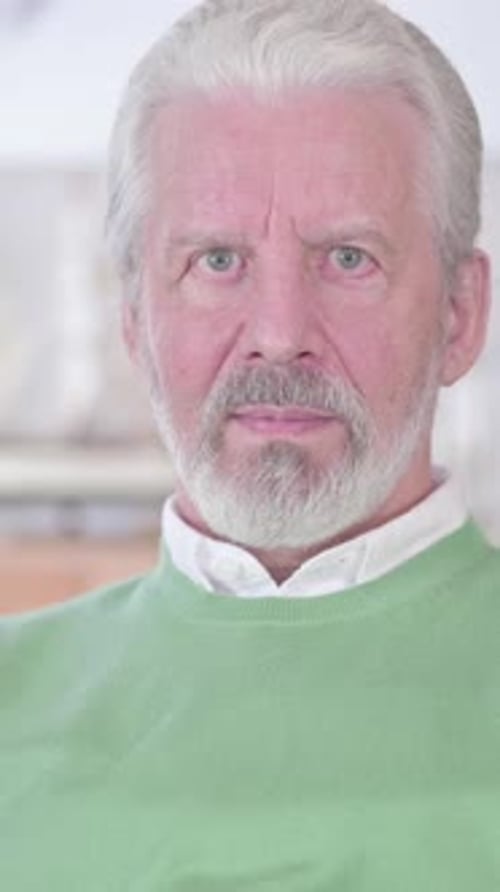 Senior Man Portrait with Light Green Sweater