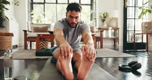 Man Stretching Hamstrings While Doing Yoga