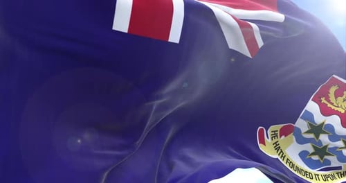 Cayman Islands Flag Waving Seamlessly Against a Bright Blue Sky